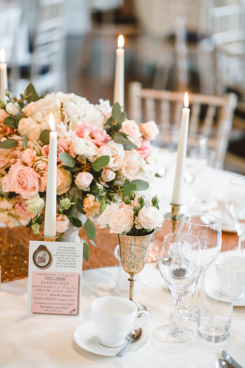 Unadorned reception tables at a Tuscan villa, white linen and natural afternoon light